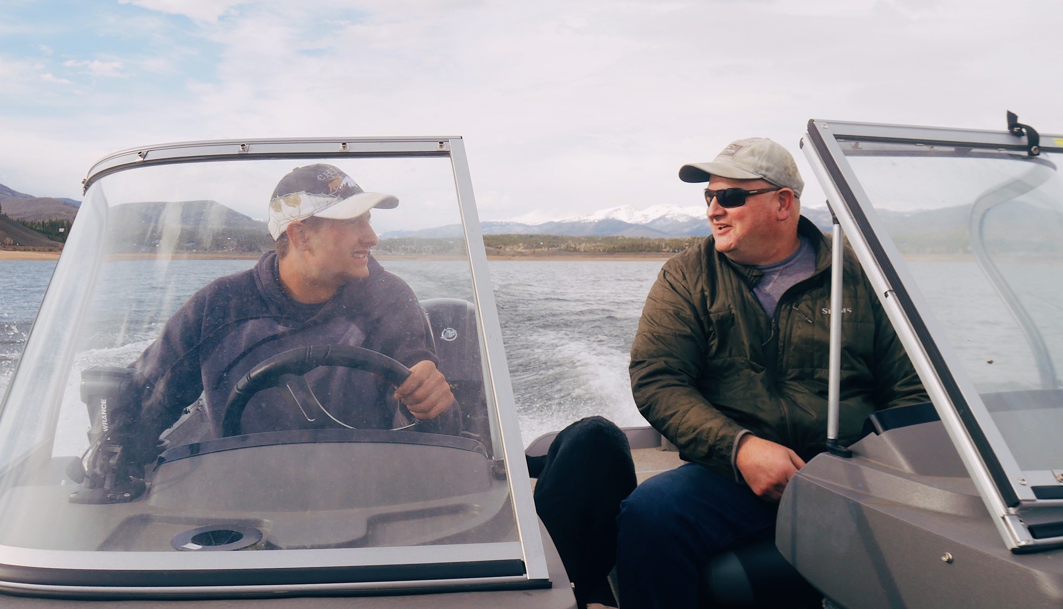 Two mens in motor boat on Grand Lake, Colorado