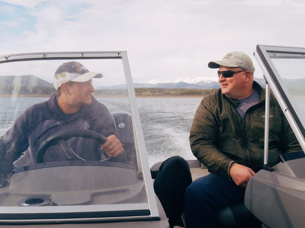 two men on a boat and chatting while under power